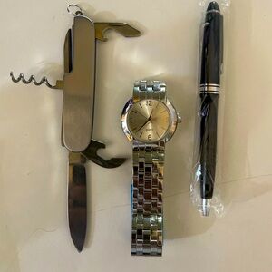 Quartz watch, pen and multi-tool set.